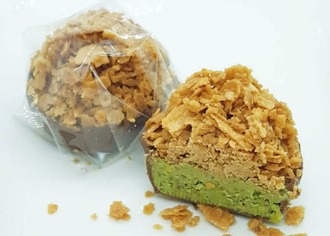 MILK CHOCOLATE PISTACHIO PASTE TOPPED WITH SWEET WAFER CRUMBLE